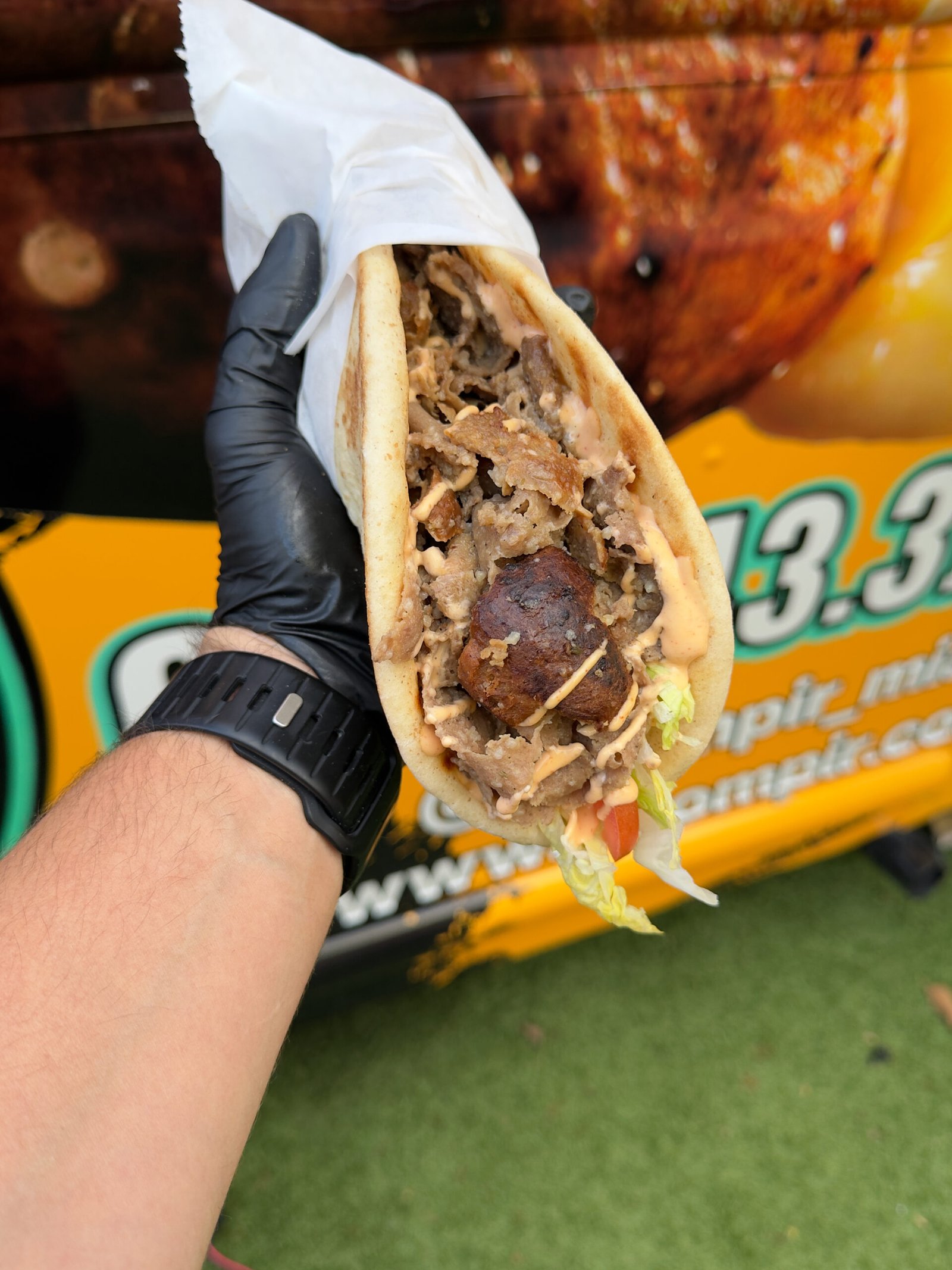 Loaded kumpir baked potato with fresh toppings close up at Koompir Miami