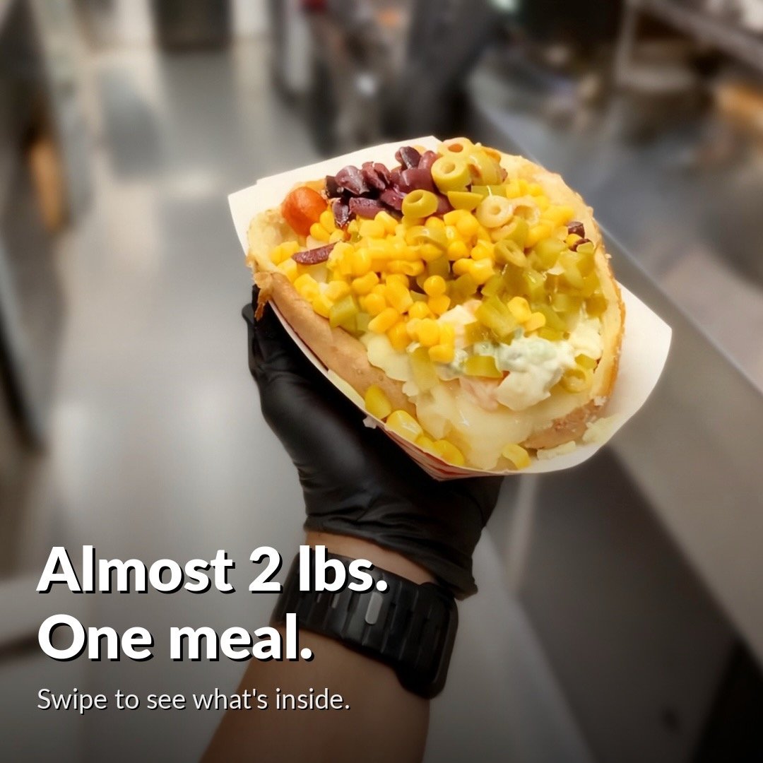 Giant loaded kumpir baked potato held in hand almost 2 pounds Miami